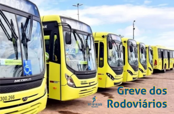 Foto mostra ônibus amarelos enfileirados lado a lado. Em primeiro plano, à direita, lê-se o texto GREVE DOS RODOVIÁRIOS em letras azuis. À esquerda deste, a logomarca do TRT-16.