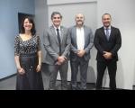 Foto mostra a juíza Carolina Burlamaqui e o juiz Carlos Eduardo Evangelista, acompanhados de palestrantes