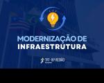 Foto da fachada do TRT-16 transparente em tom azul escuro. Em primeiro plano, vê-se ícone de lâmpada com raios e setas, texto MODERNIZAÇÃO DE INFRAESTRUTURA e logomarca do Tribunal.