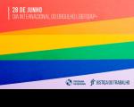 Arte feita com as cores do arco-íres. Na parte superior a informação 28 de junho: Dia Internacional do Orgulho LGBTQIAPN+